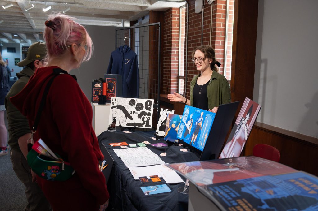 Graphic design student showcases her work at a senior show